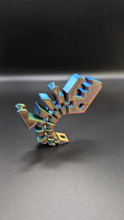 3d printed custom articulated fidget toy dinosaur keychain